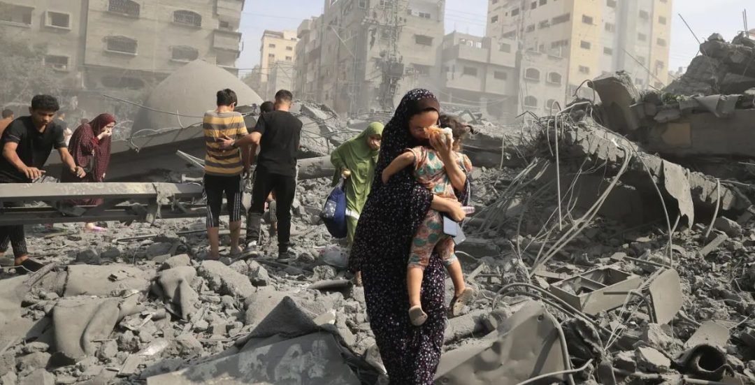 Palestinians evacuate the area following an Israeli airstrike on the Sousi mosque in Gaza City on October 9, 2023. AFPMahmud Hams, via UNOCHA