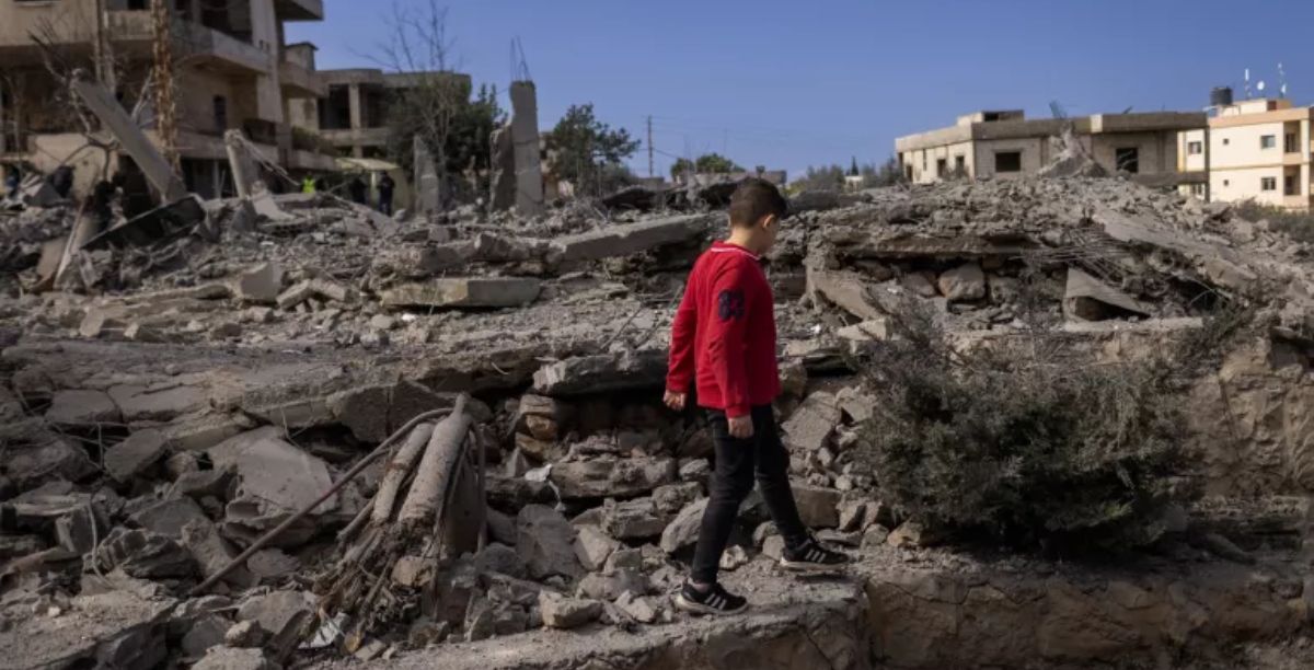 UNICEFUNI561766Diego Ibarra Sánchez On February 22, 2024, a Lebanese child walks through the rubble of a house destroyed by an airstrike in Majdal Zoun, south Lebanon.