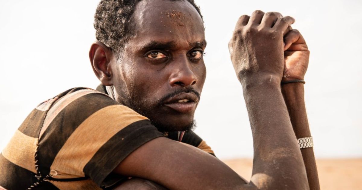 Omar, an Ethiopian migrant, is treated for dehydration and exhaustion by IOM’s Mobile Unit in the Djiboutian desert. Photo IOM 2020Alexander Bee
